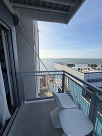 From 3rd flr balcony side view to rear Bay Area