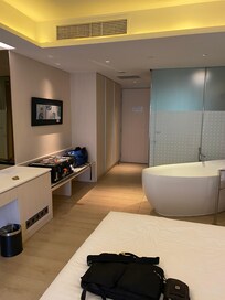 This room has a bathtub by the bed. It is suitable for a couple instead of single.