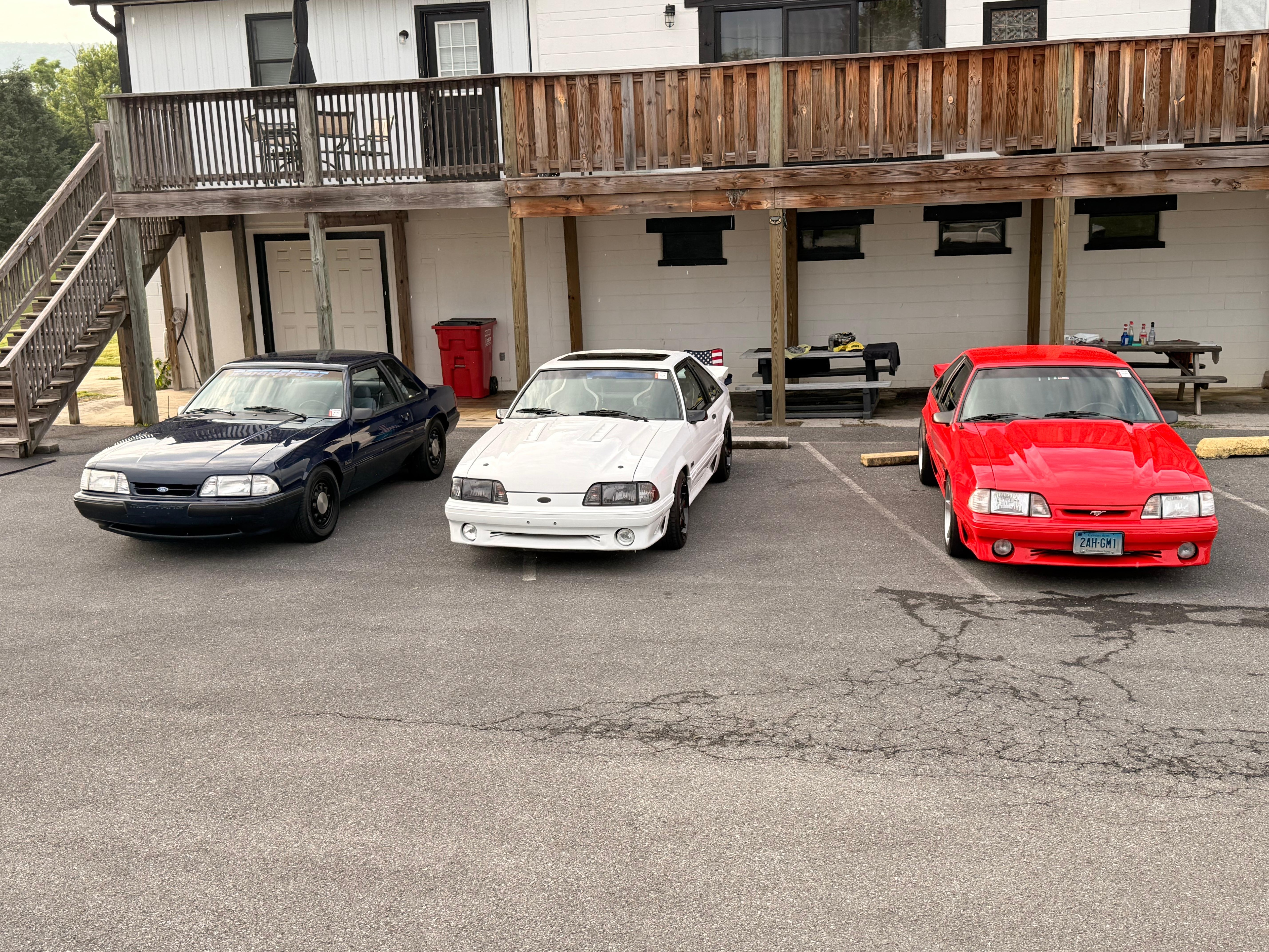 Apartments are on the upper level, parking is the lot for the now closed deli/gas station. This shows the flight of stairs and upper deck.  