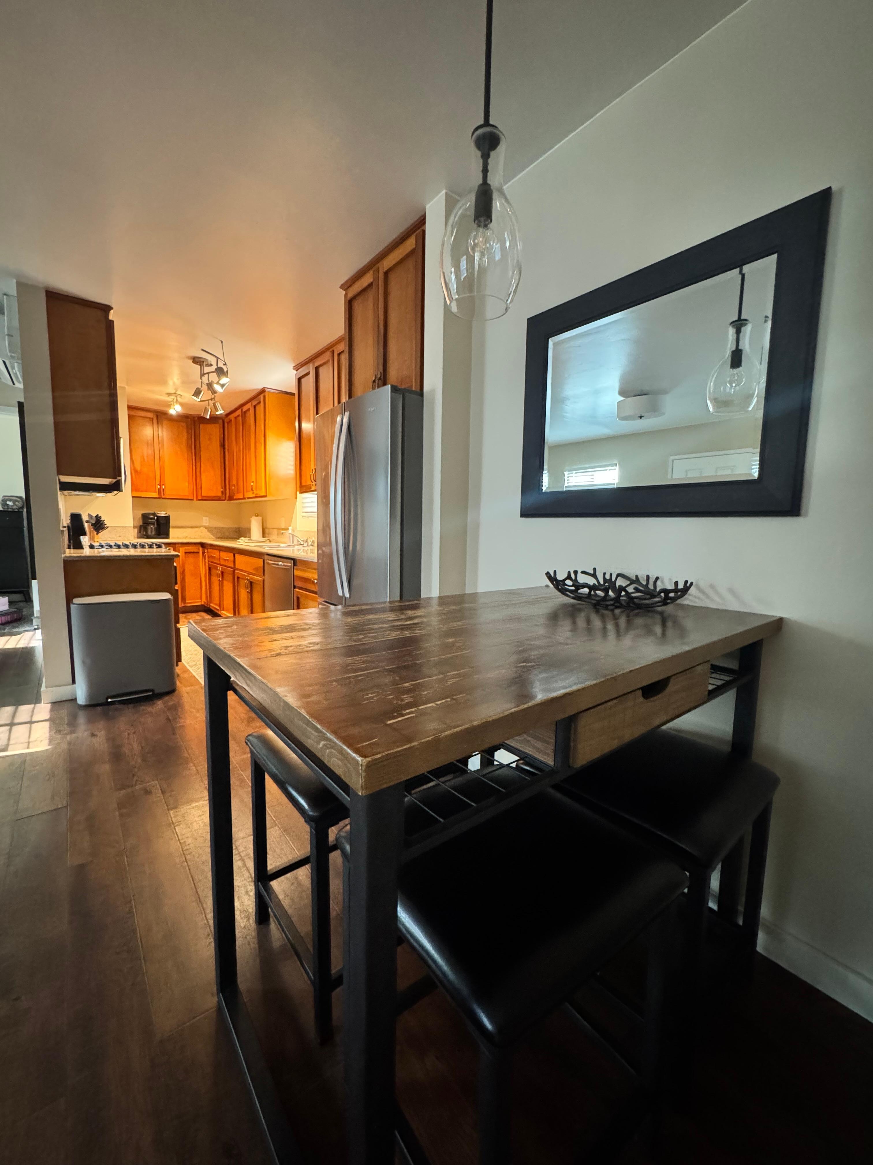 Dining table with view of kitchen