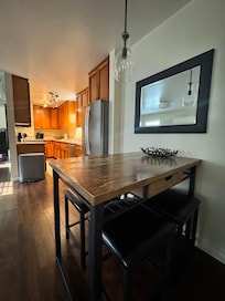 Dining table with view of kitchen