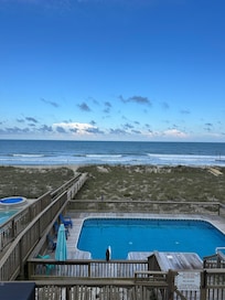 View of the pool, walkway, and ocean from the top balcony! Beautiful :)