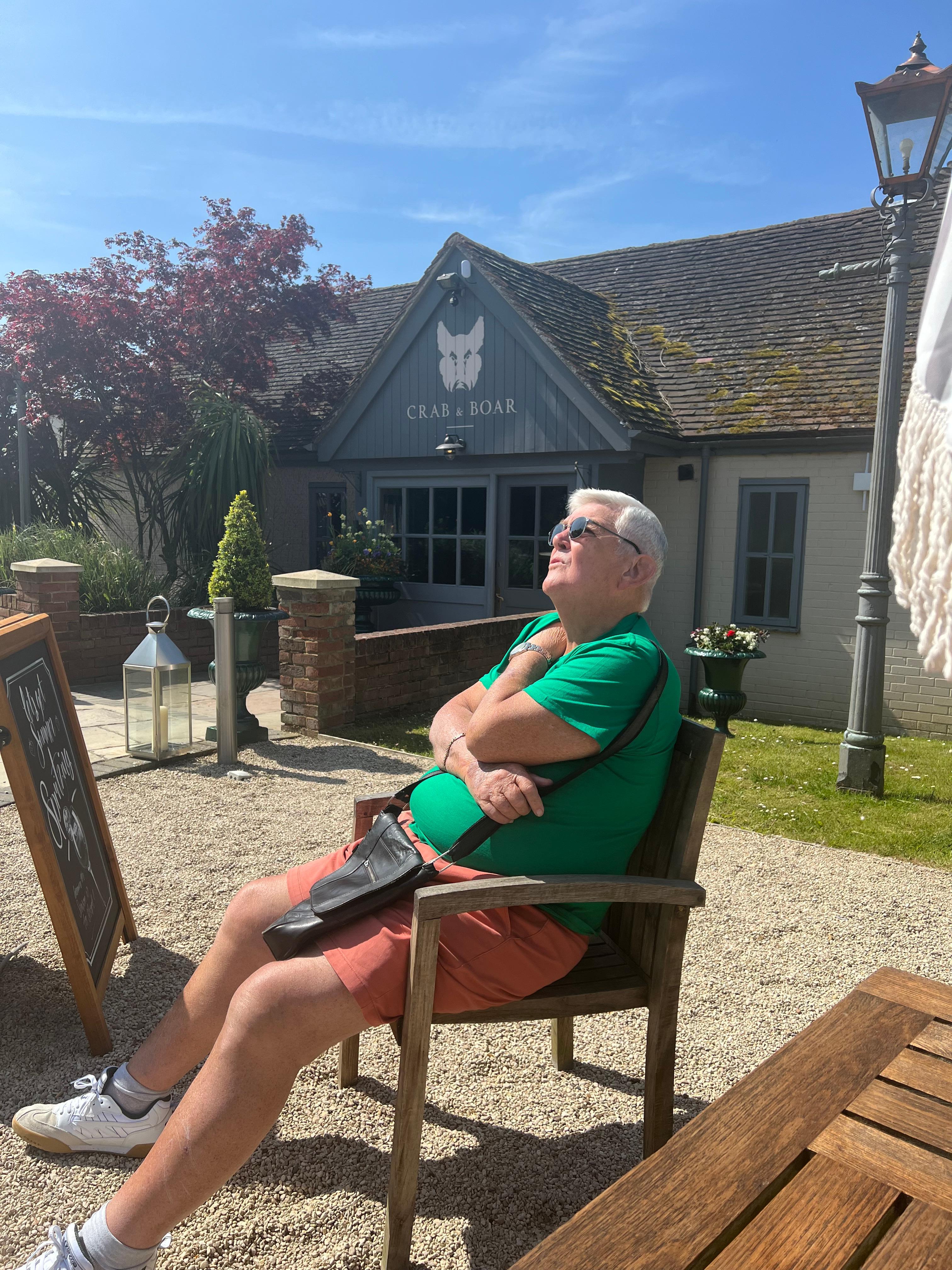 My father basking in the sunshine and beautiful grounds!