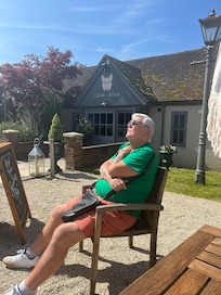 My father basking in the sunshine and beautiful grounds!