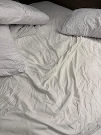 Wrinkled sheets and pillowcases. Photos and videos taken the morning after the previous night.