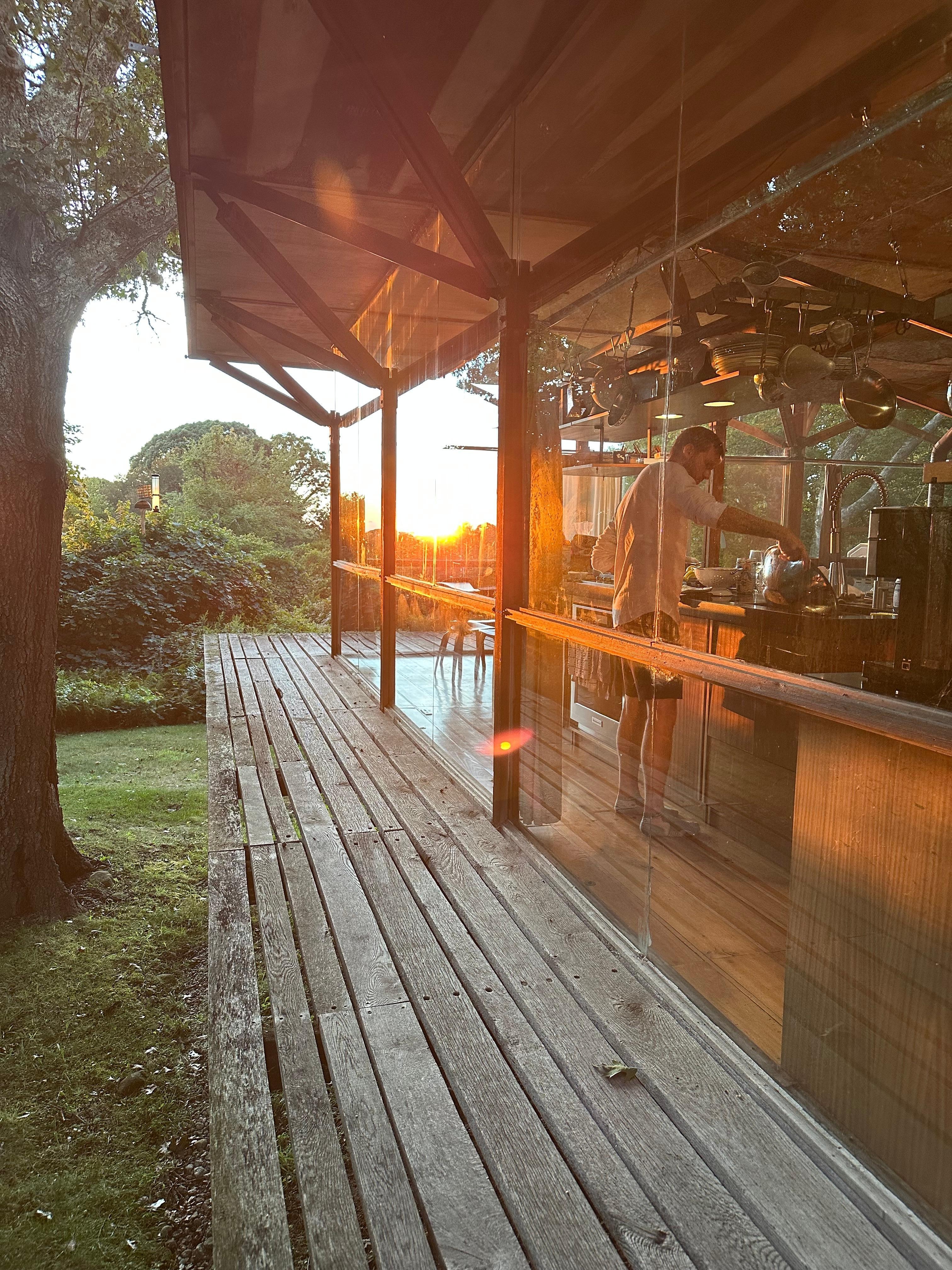 A pic of my son cooking scallops while the sun is starting to set.
