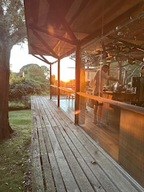 A pic of my son cooking scallops while the sun is starting to set.