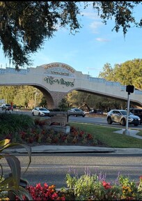 Golf Cart bridge over US 27/441 to Spanish Springs Town Center/Square.