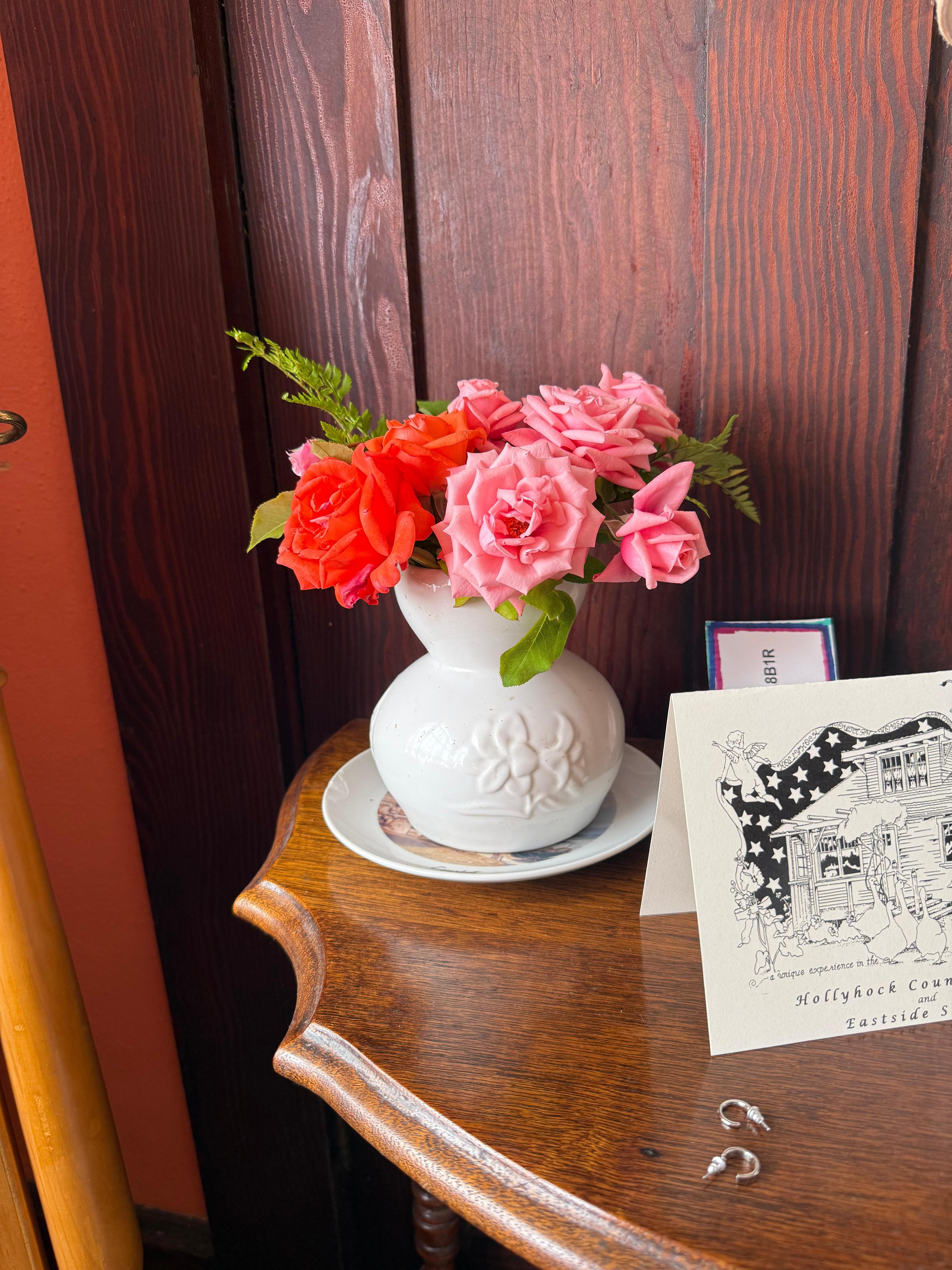 Fresh flowers in the bed room bed side table