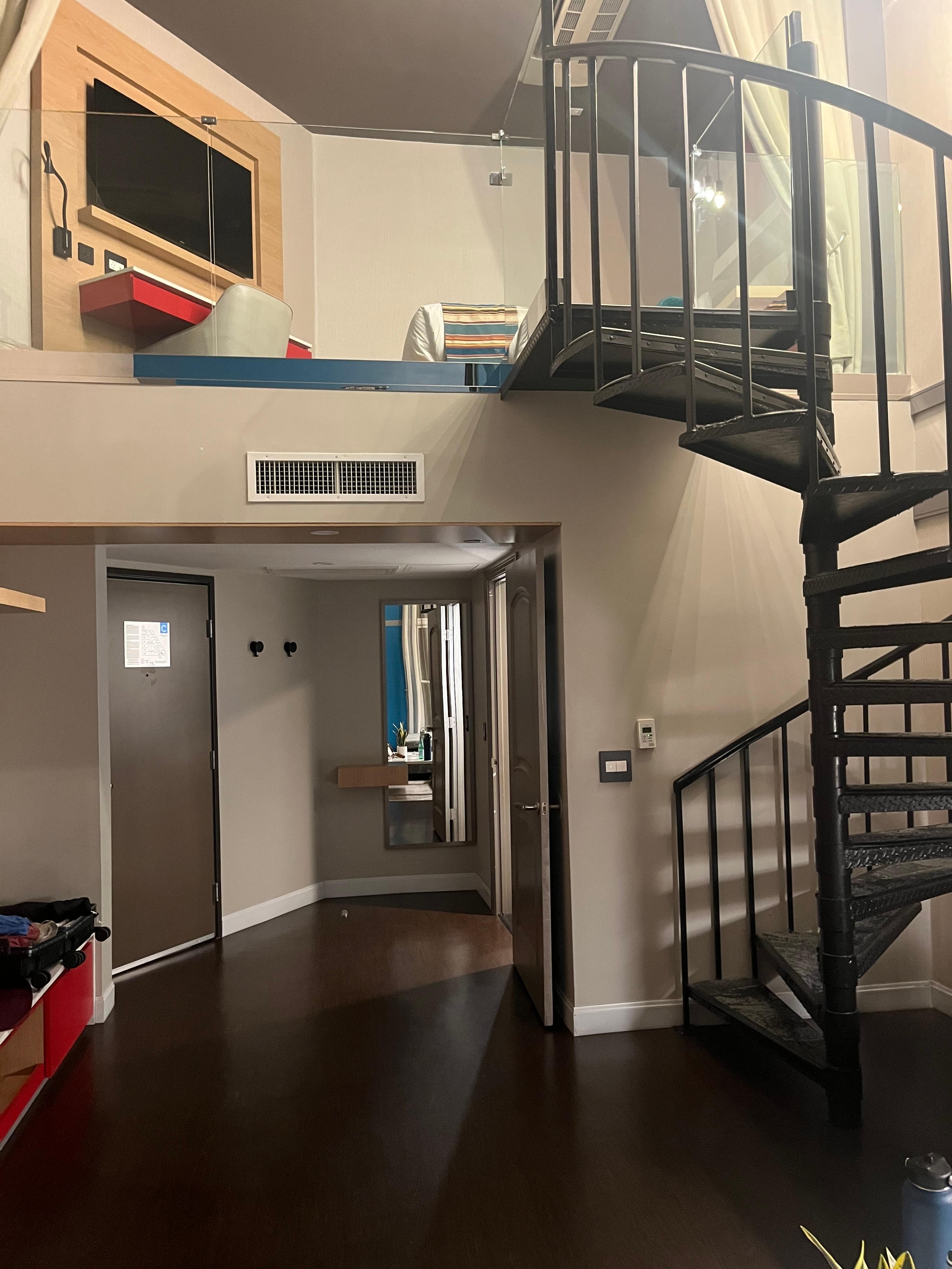 Spiral staircase to sleeping loft. A breathtaking room. 