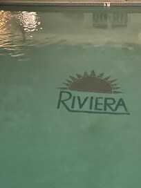 Clean pool area with lounge chairs
