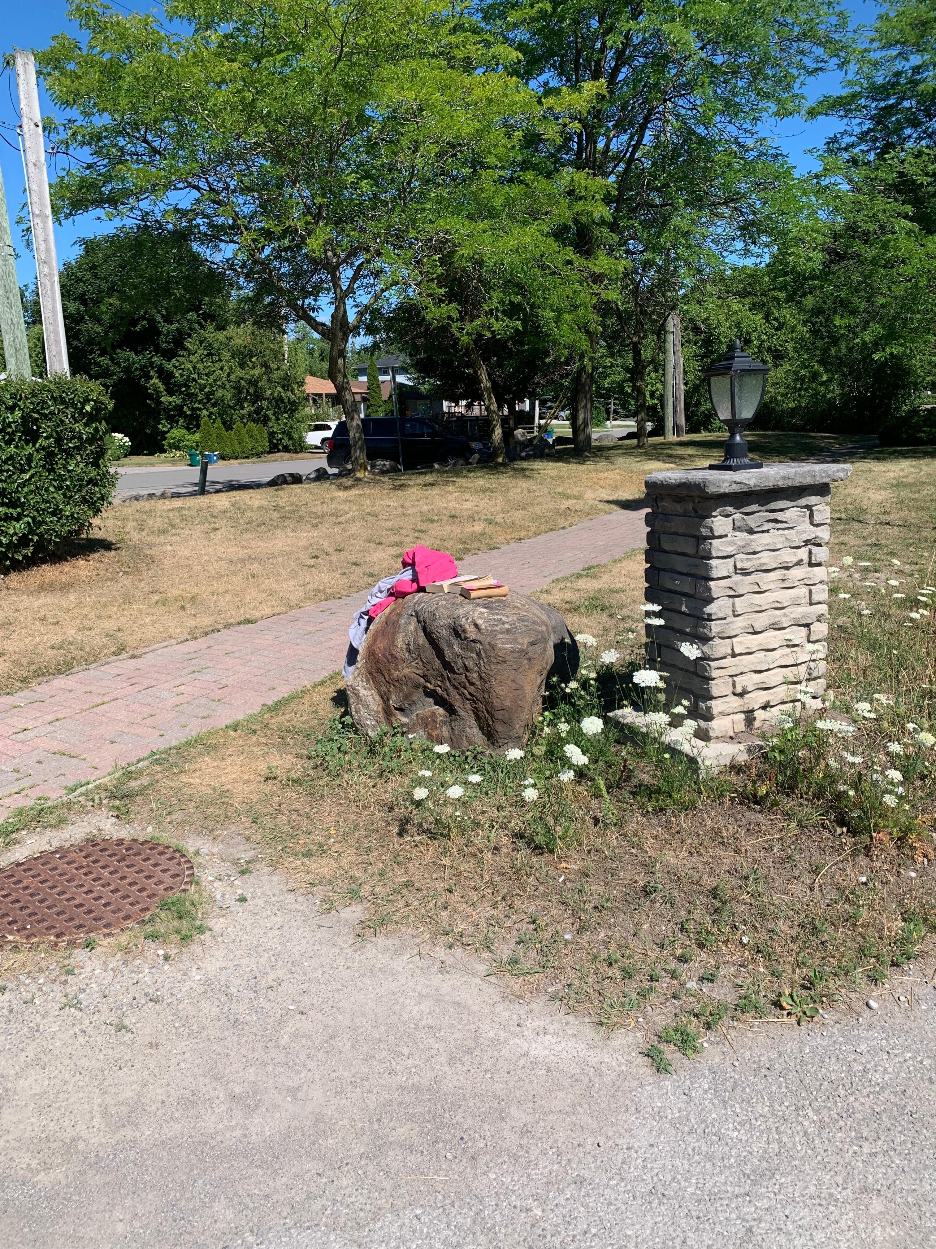 Abandoned clothing and books for two days at front entrance