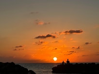 Watching the sunset on the rocks in the cove!