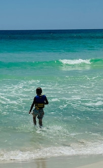 My grandson having a blast in the emerald water!