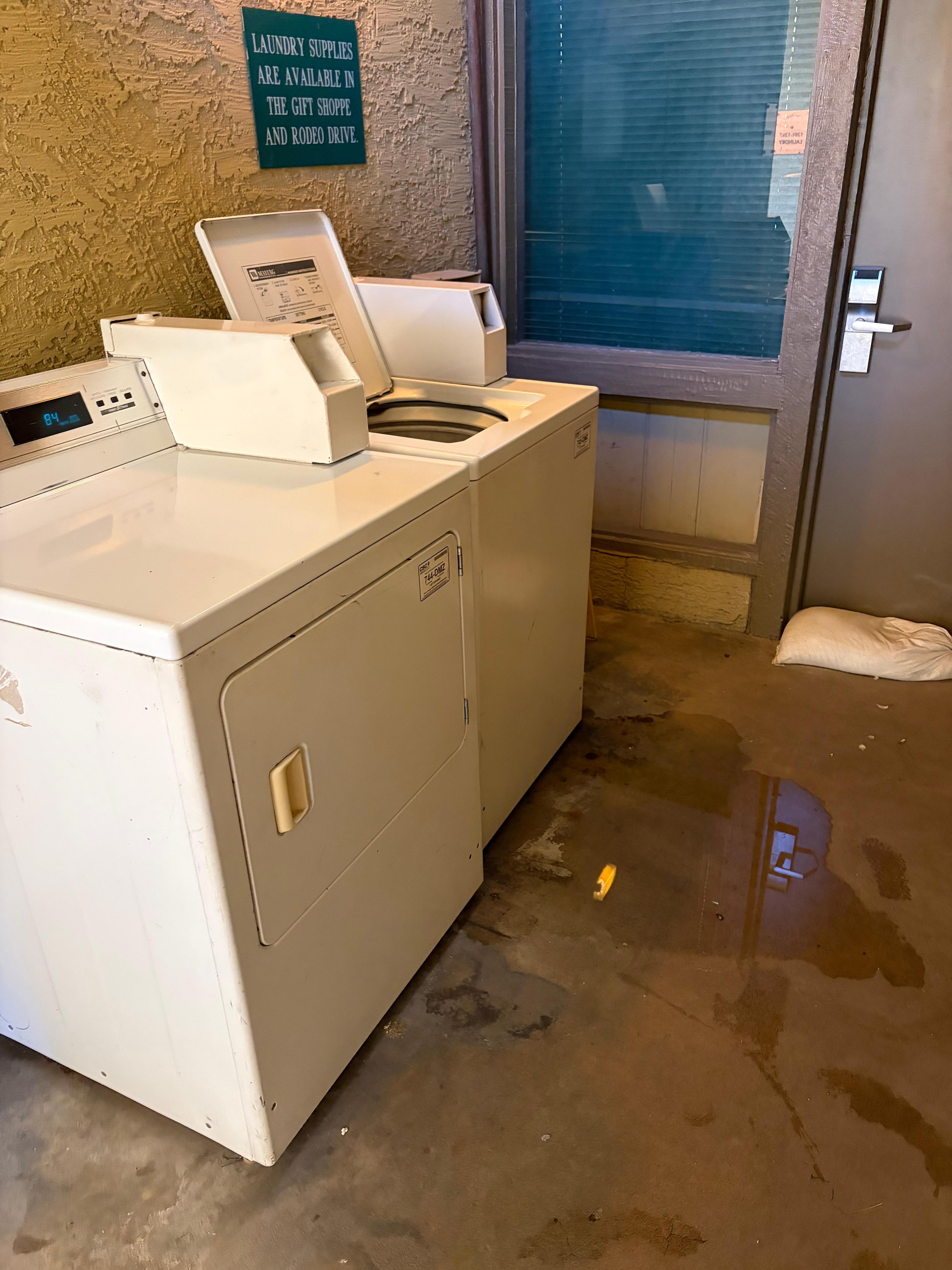 I should have known the washer would flood - see the sand bags next to that door. 