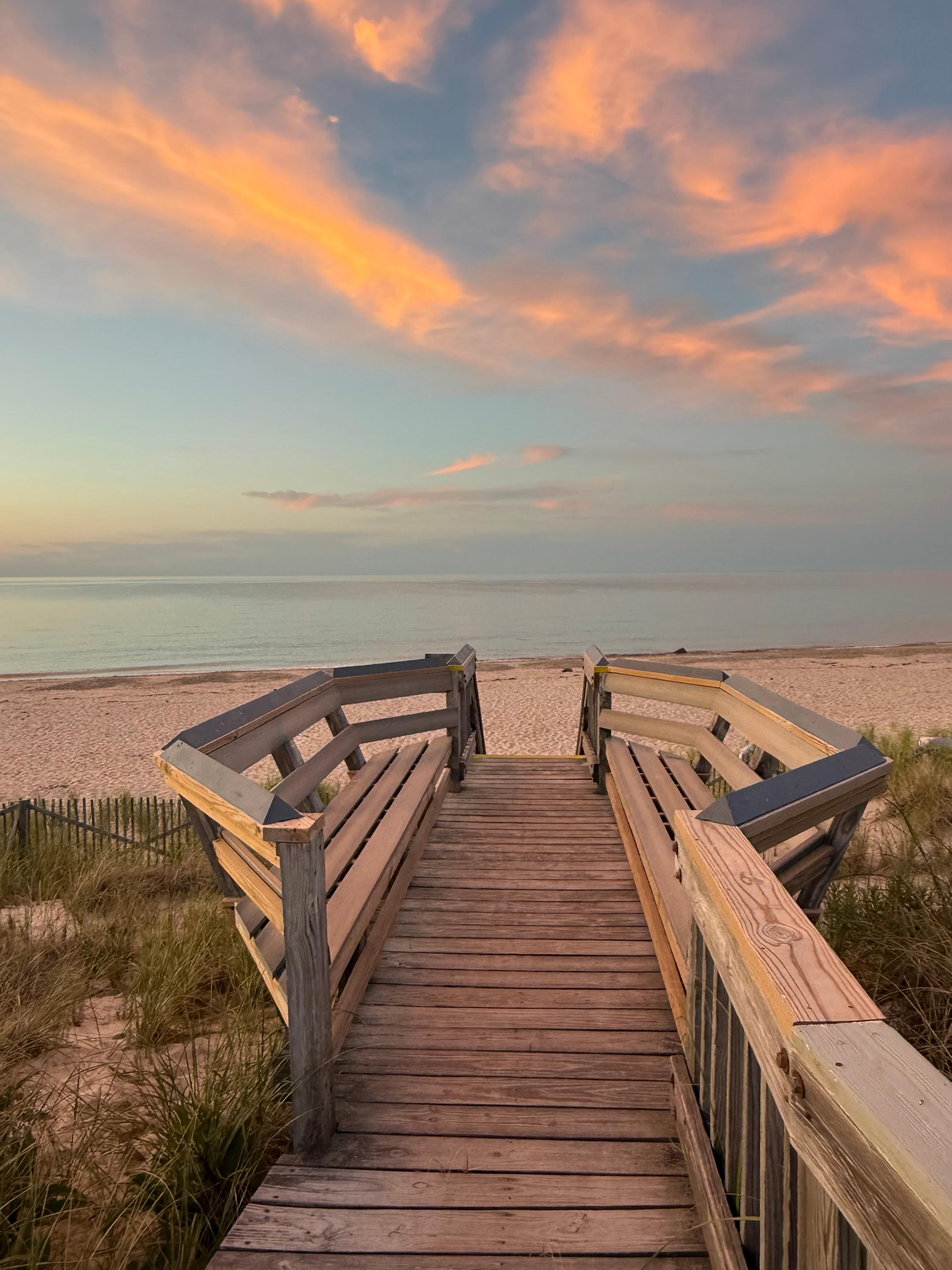 Boardwalk to beach at sunset 