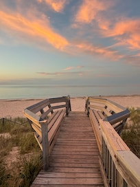 Boardwalk to beach at sunset