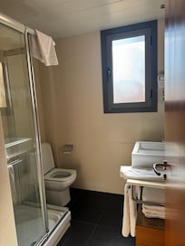Small bathroom. Soap and combo shampoo/body wash were provided