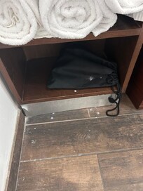 Paint drippings on the floor and blow dryer bag