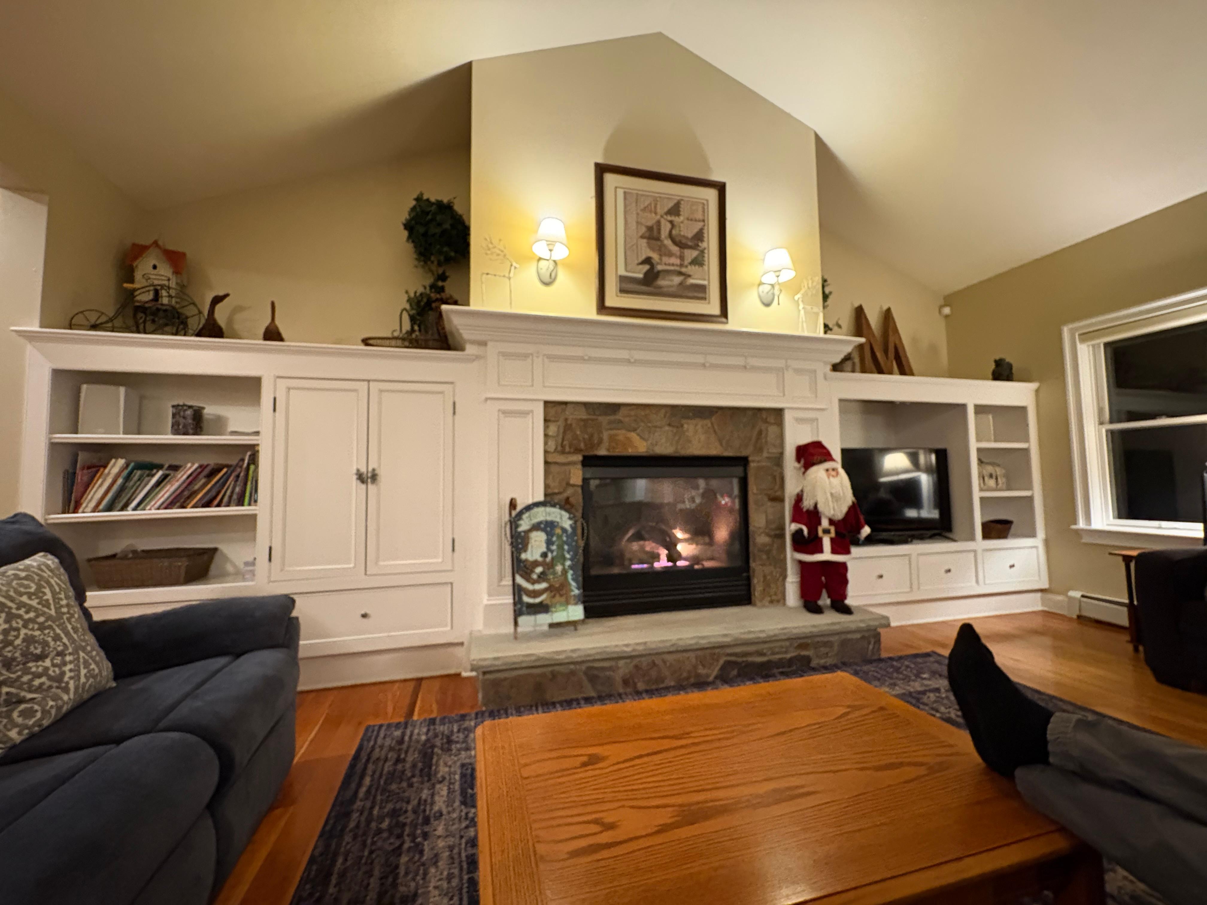 Beautiful living room with plenty of seating and a gas fireplace. 