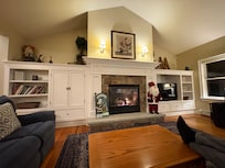 Beautiful living room with plenty of seating and a gas fireplace.