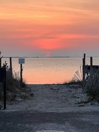 Sunset at the end of the road on the bay.