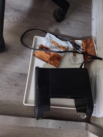 Coffee maker and packets of coffee but NO coffee pot, cup, spoon, cream, sugar