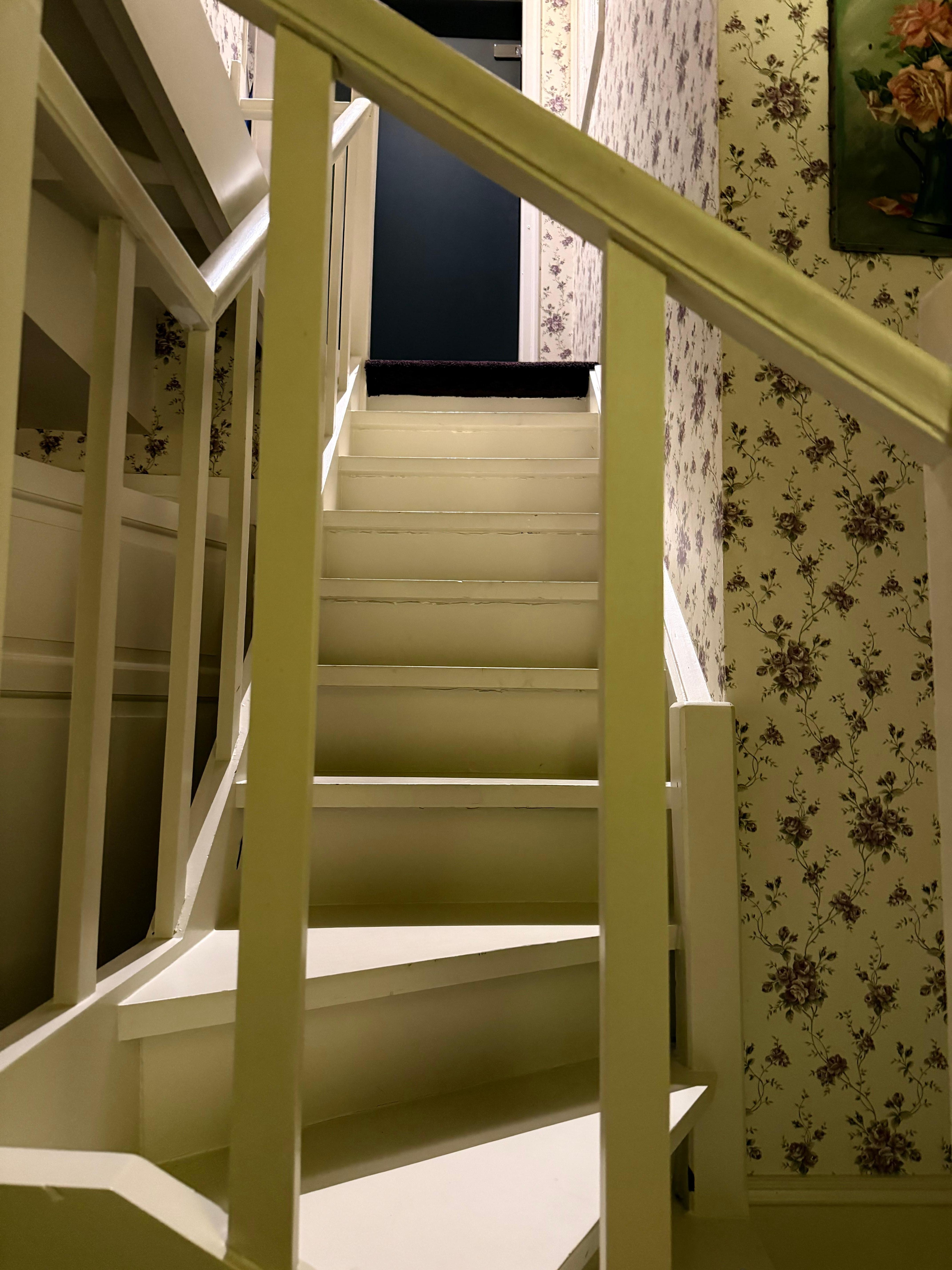Winding stairs to upstairs bedroom 