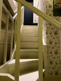 Winding stairs to upstairs bedroom