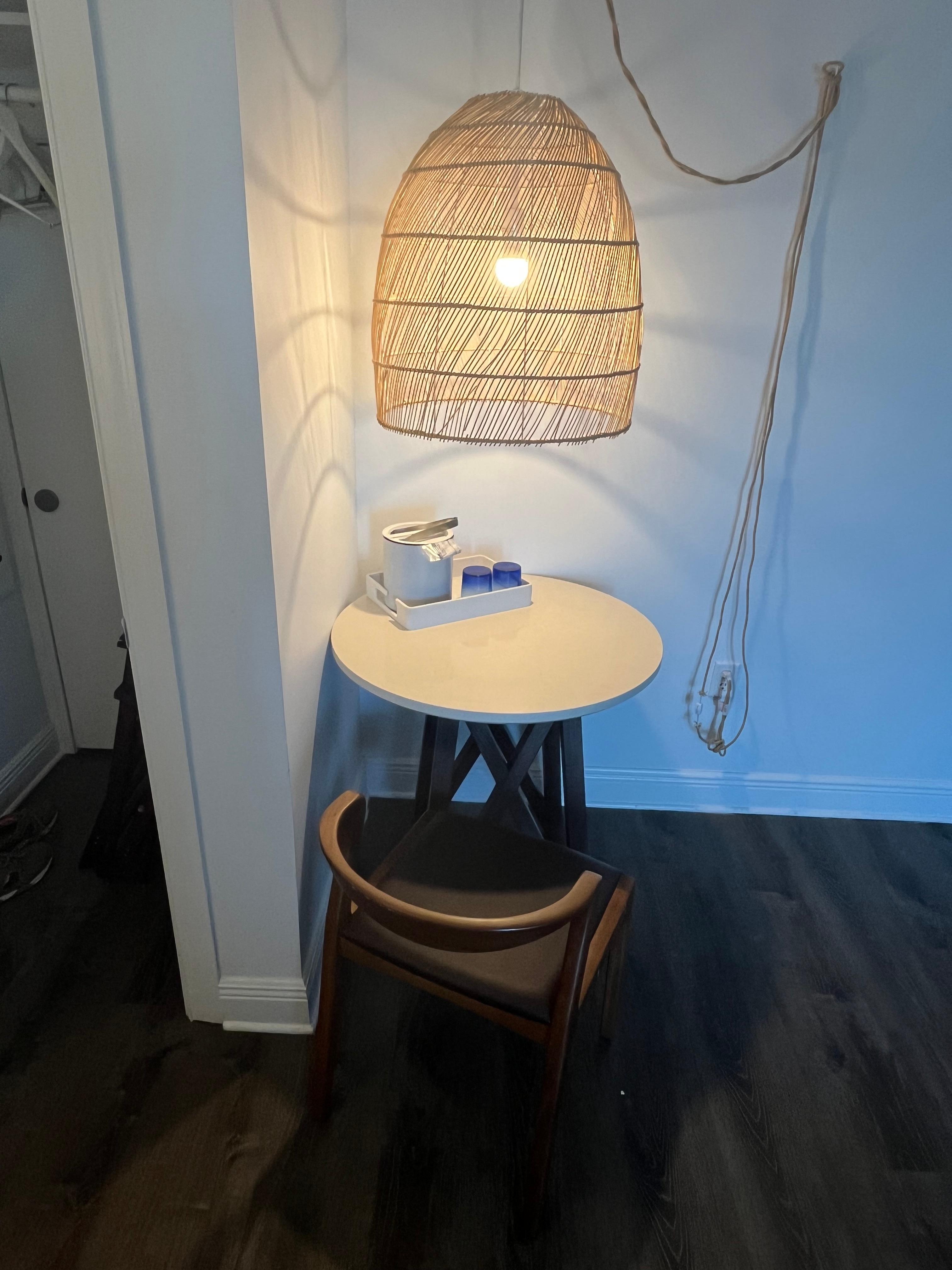 One small table & chair in king size room 