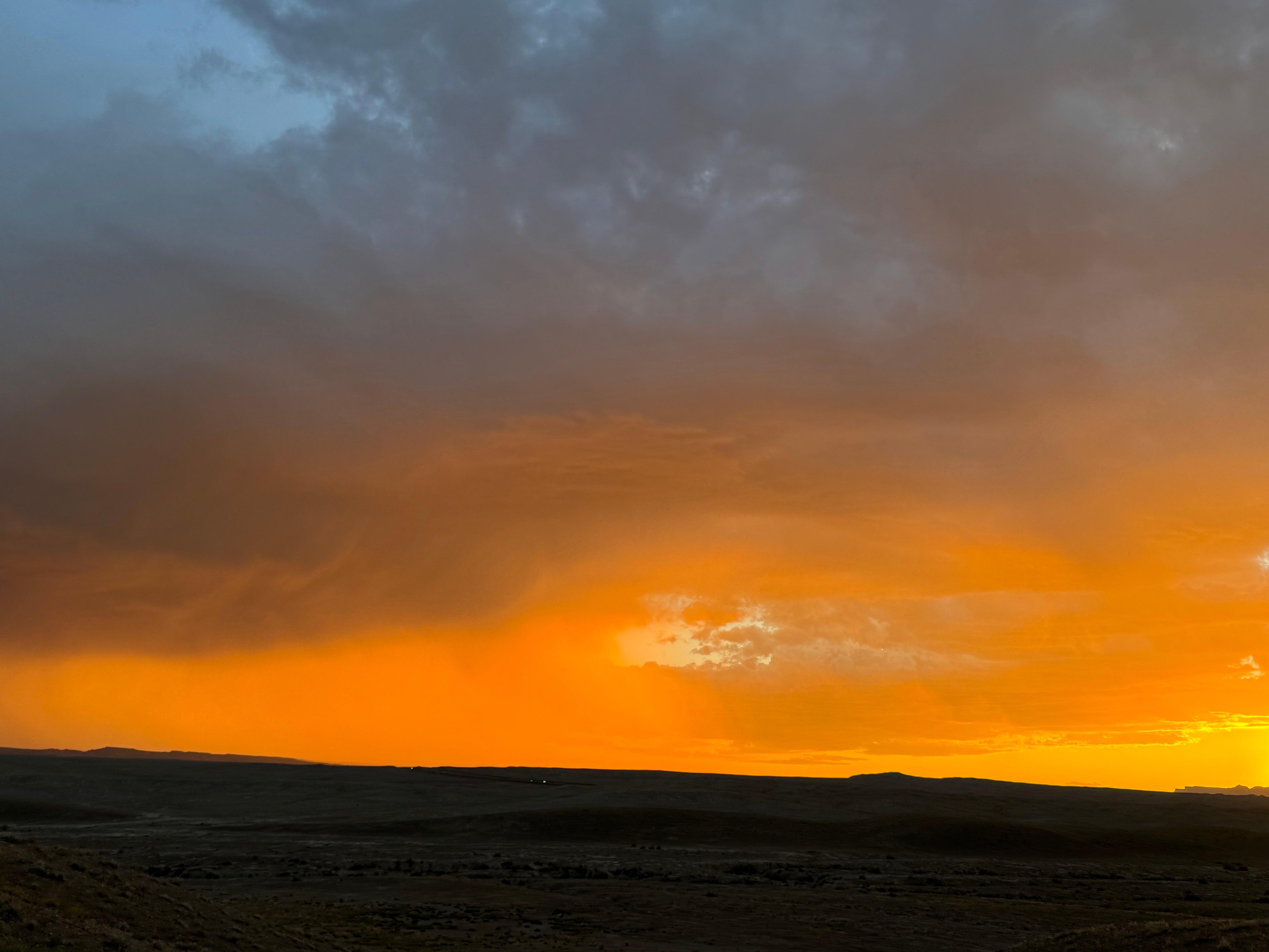 Sand storm being chased by rain storm leaving Moab Utah