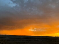 Sand storm being chased by rain storm leaving Moab Utah