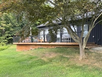 Side of the house facing the pond.