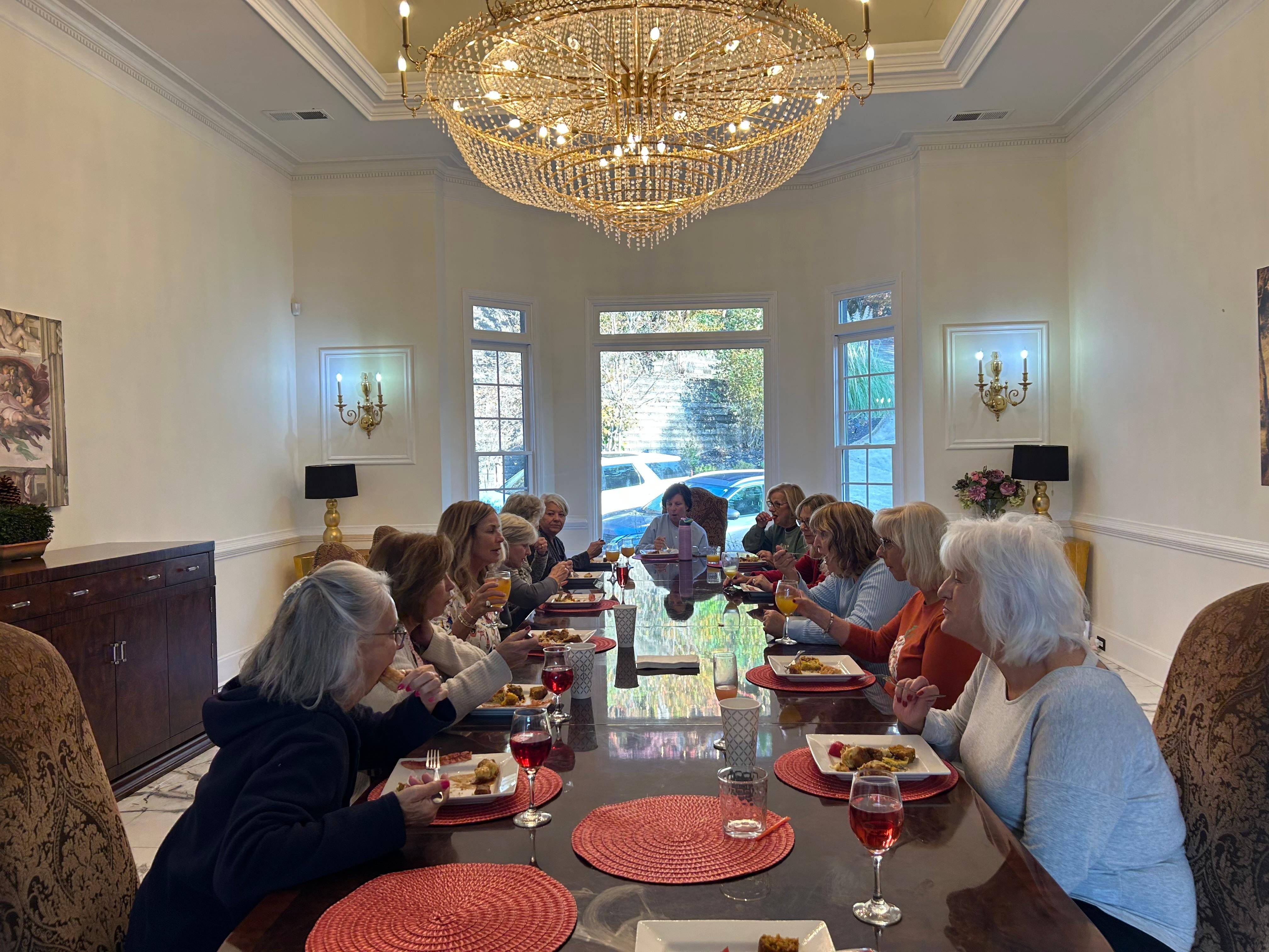 Dining room with massive chandelier 