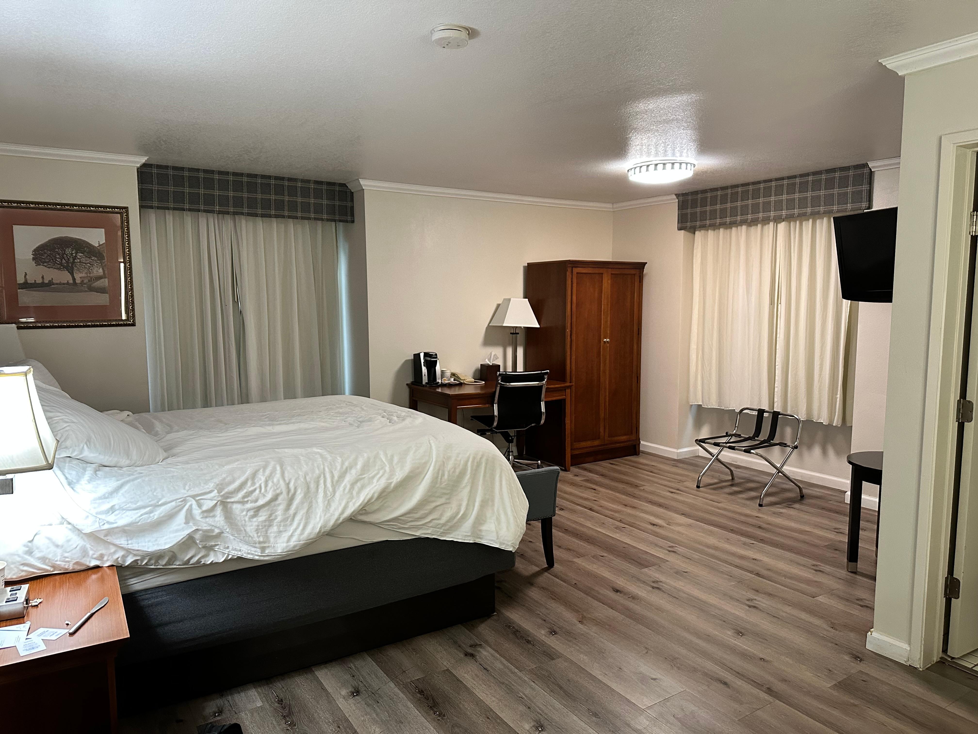 Faux wood floor, dim fluorescent lighting, noisy refrigerator