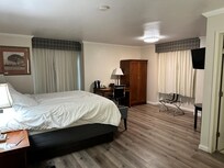 Faux wood floor, dim fluorescent lighting, noisy refrigerator