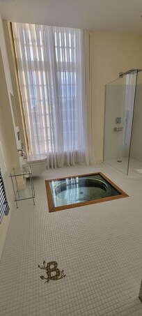 Our bathroom - must be an original tub that they covered to protect - very awesome to see