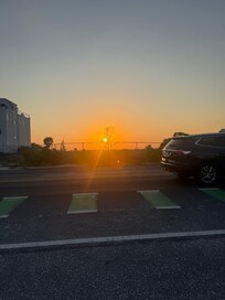 Sunset across street on beach