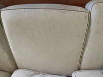 Sofas and armchairs covered with stains everywhere.