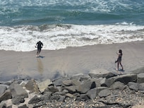 Playing right out front of the house during low tide!