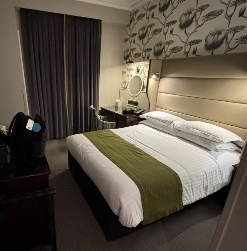 Tiny room with a queen size bed.