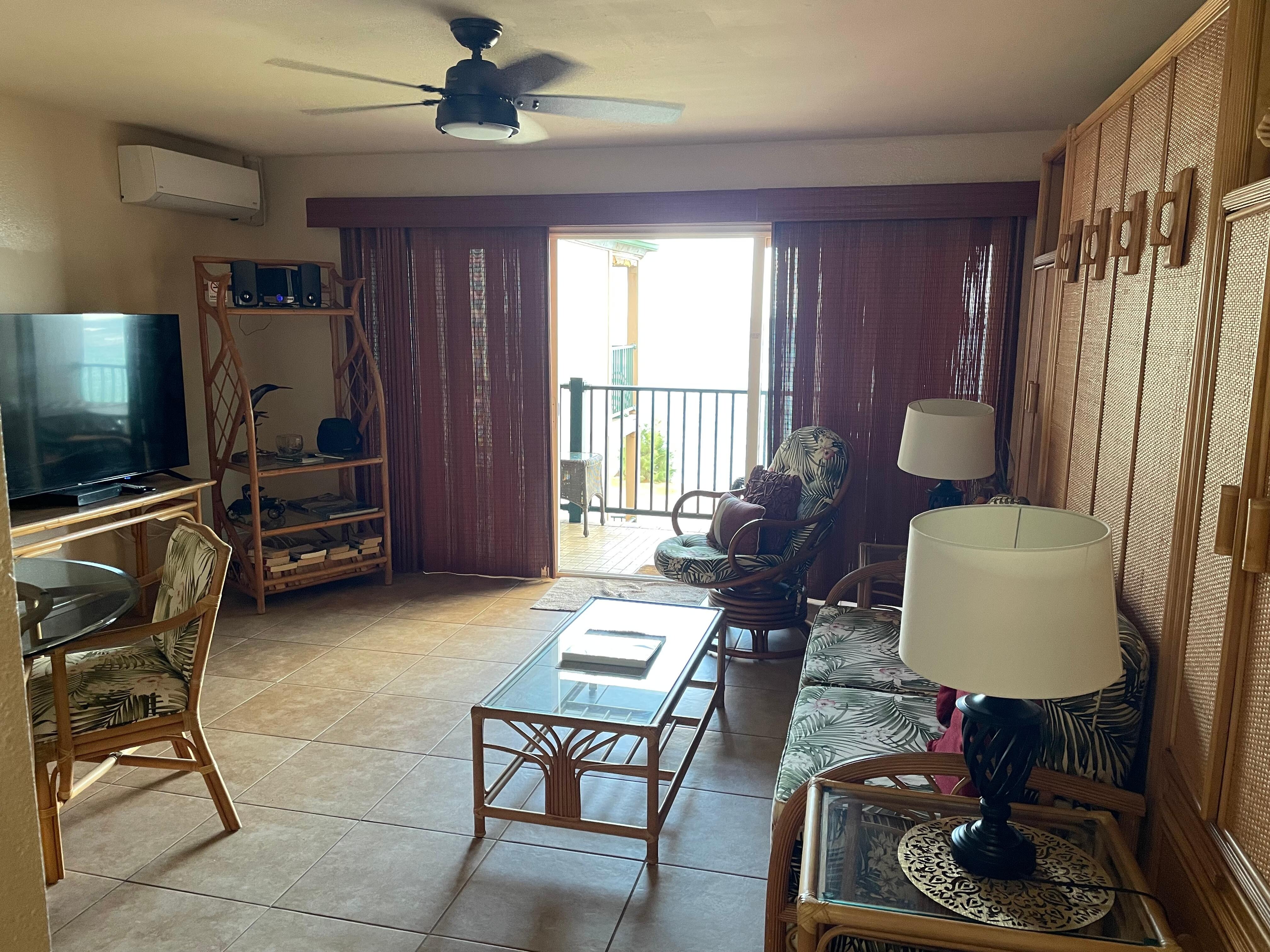 View from little hall into living room to the porch