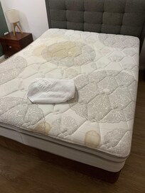 Filthy stained mattress beds not even made