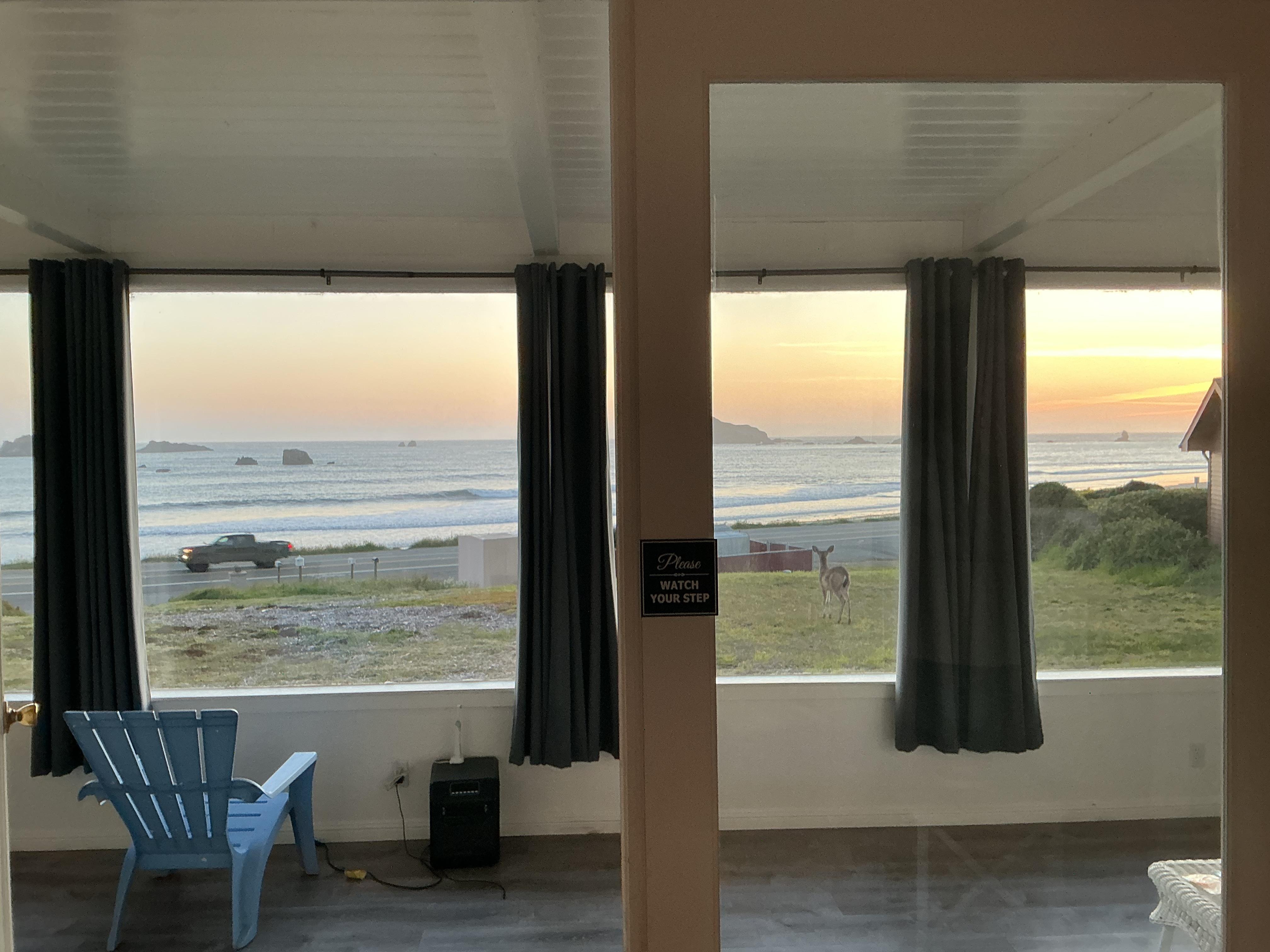 Sitting room/enclosed porch. . .a place to drink coffee and watch the waves.