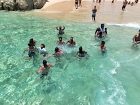 Refreshing swim time at the beach