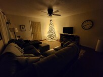 The living room, so cozy and cute. With the fireplace on it was 🤌