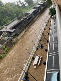 Smoking area with fire pits tables chairs and a hammock