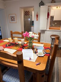 Dining area with fresh flowers.