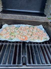 Grilling fresh shrimp on the grill.