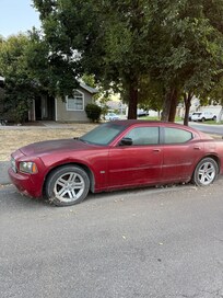 Abandoned car right in front of property